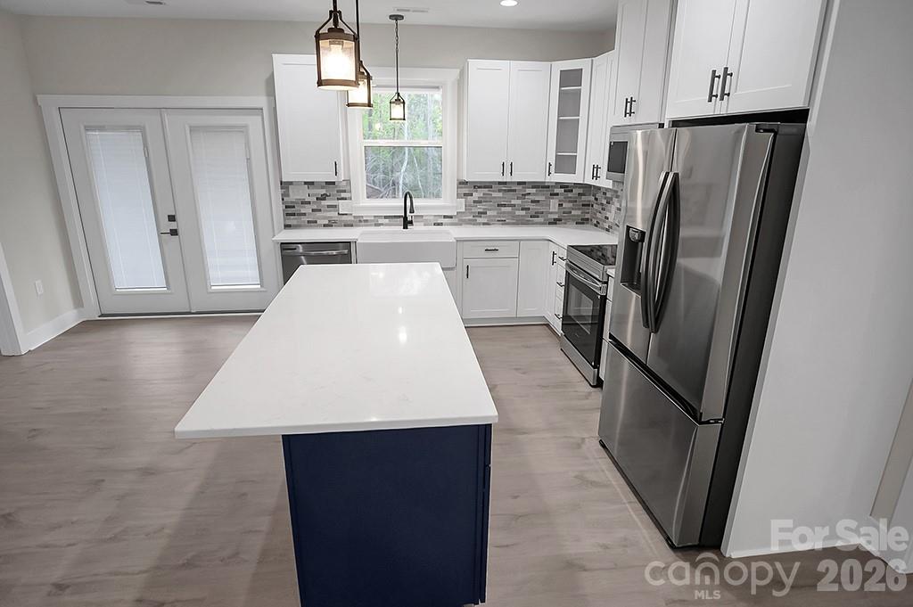 129 Rosecommon Lane Rutherfordton, NC 28139 - Photo 12 of 31 a kitchen with stainless steel appliances a refrigerator a sink a stove a microwave a counter top space and cabinets