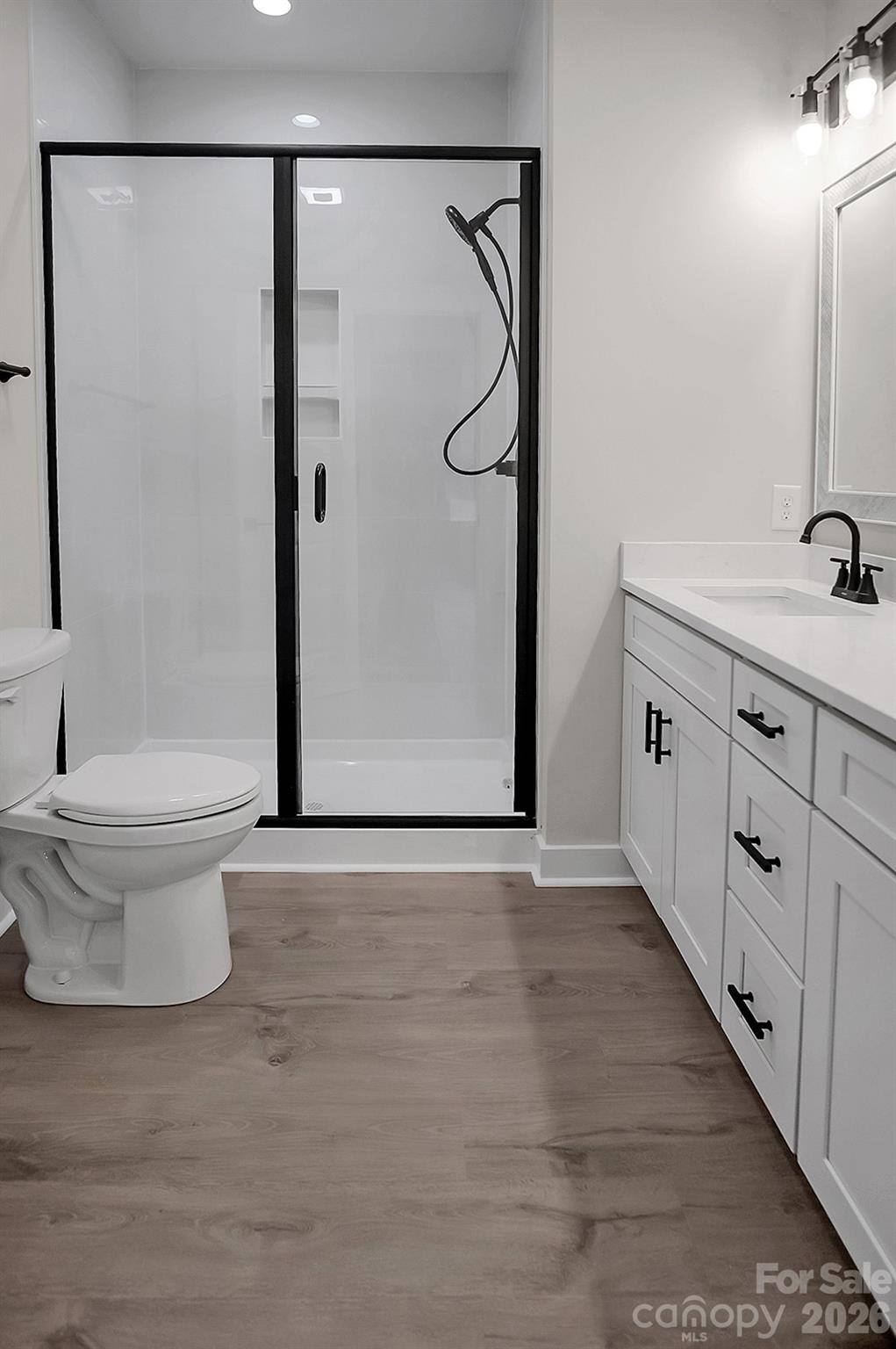 129 Rosecommon Lane Rutherfordton, NC 28139 - Photo 20 of 31 a bathroom with a double vanity sink toilet and shower