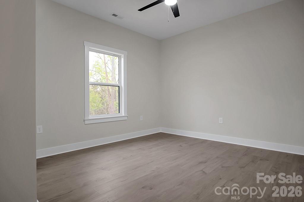 129 Rosecommon Lane Rutherfordton, NC 28139 - Photo 22 of 31 an empty room with a window and a ceiling fan
