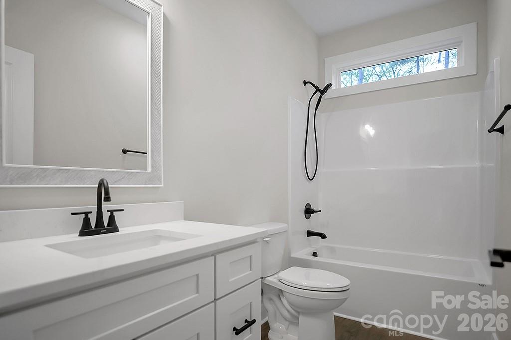 129 Rosecommon Lane Rutherfordton, NC 28139 - Photo 23 of 31 a bathroom with a sink a toilet and shower