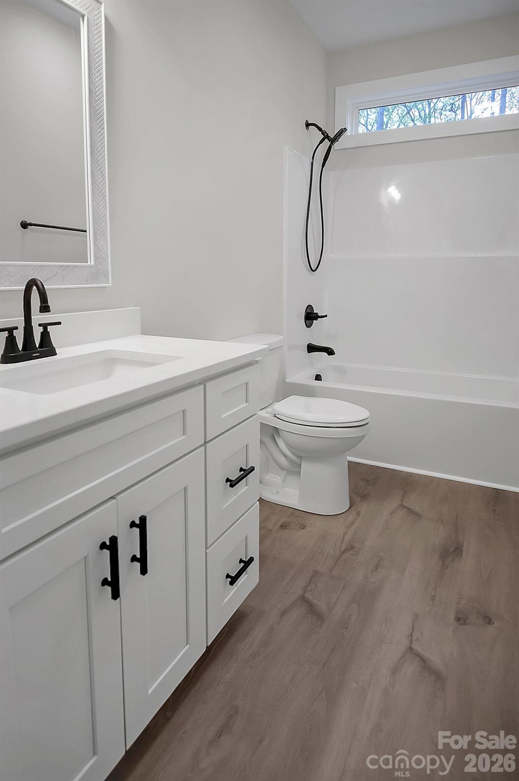 129 Rosecommon Lane Rutherfordton, NC 28139 - Photo 24 of 31 a bathroom with a sink a toilet and a mirror