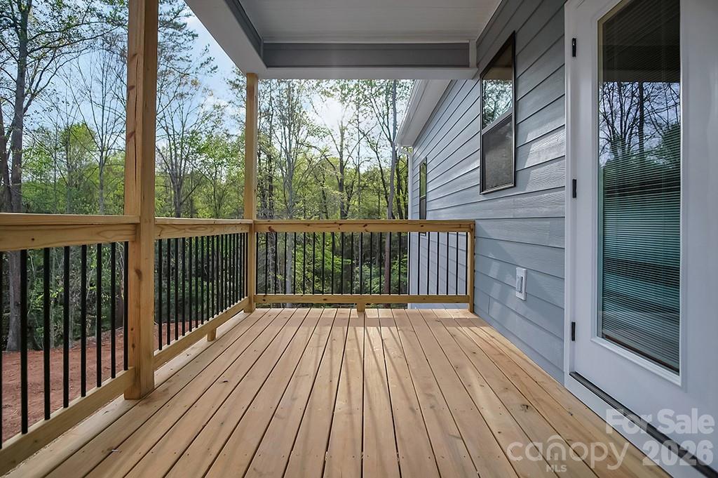129 Rosecommon Lane Rutherfordton, NC 28139 - Photo 26 of 31 a view of backyard with wooden floor and iron fence