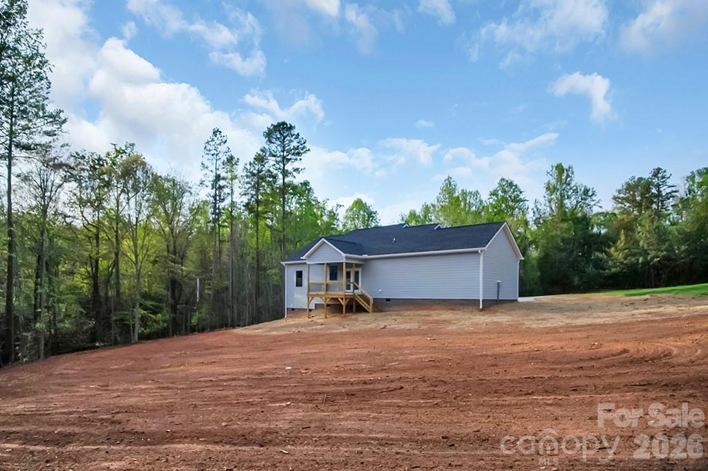 129 Rosecommon Lane Rutherfordton, NC 28139 - Photo 29 of 31 a view of a house with backyard and trees