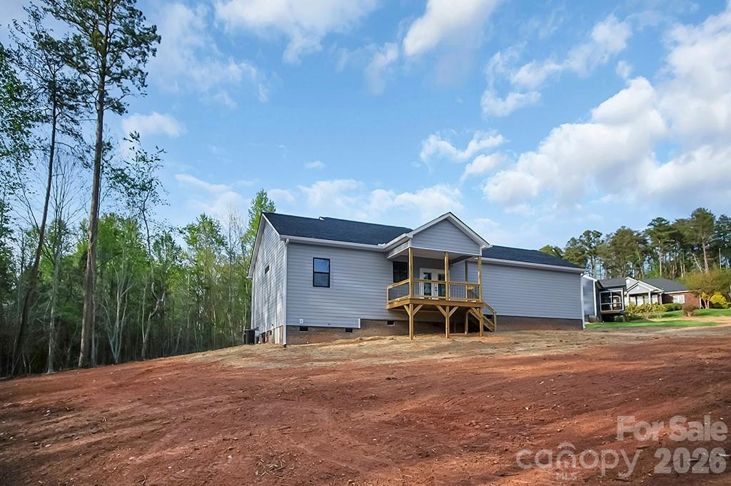 129 Rosecommon Lane Rutherfordton, NC 28139 - Photo 30 of 31 a front view of a house with a yard and garage
