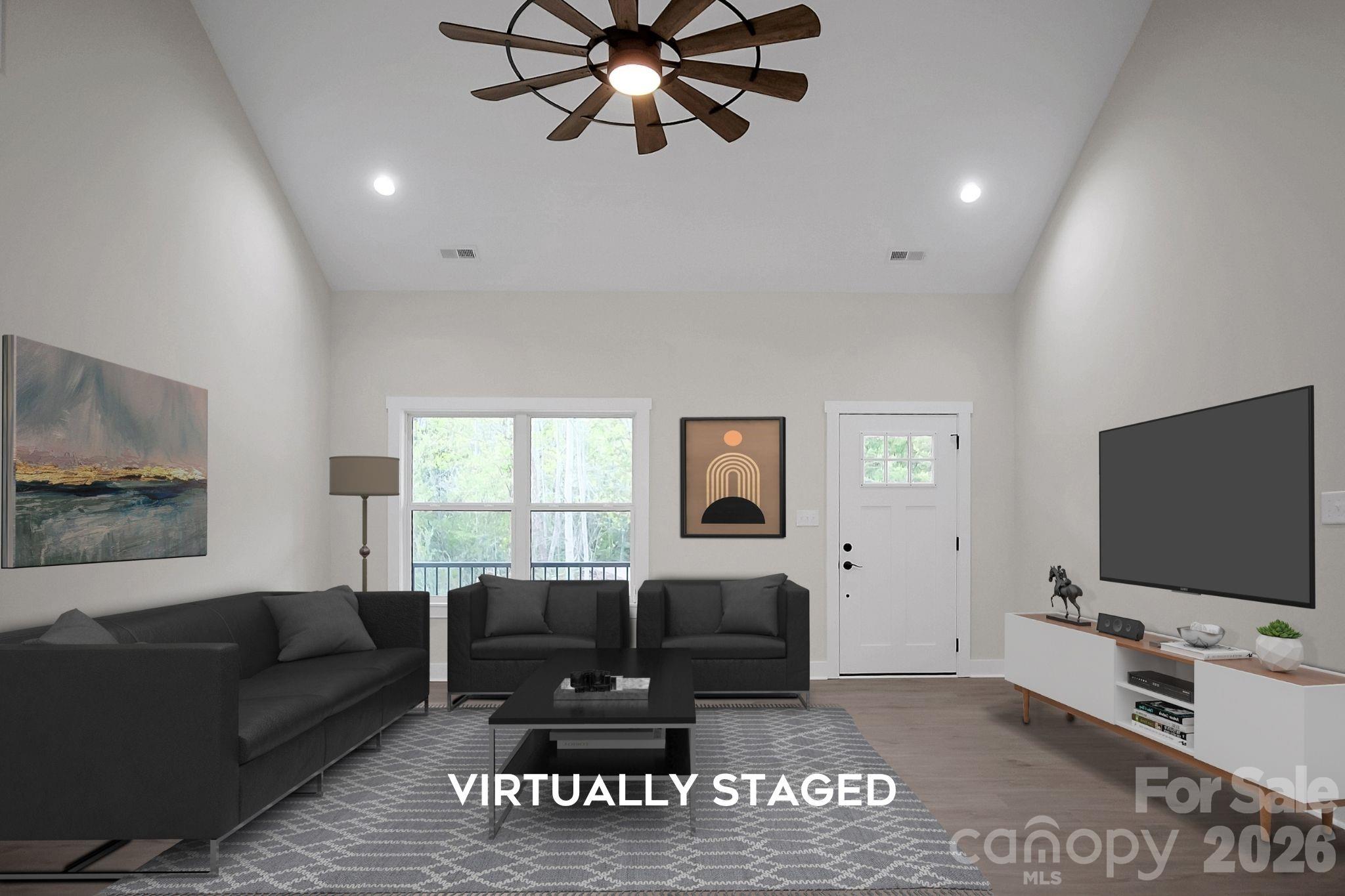 129 Rosecommon Lane Rutherfordton, NC 28139 - Photo 3 of 31 a living room with furniture and a flat screen tv