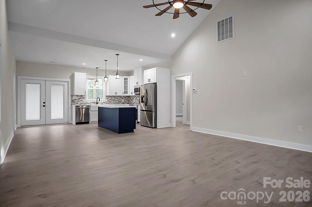 129 Rosecommon Lane Rutherfordton, NC 28139 - Photo 6 of 31 a large kitchen with cabinets and stainless steel appliances