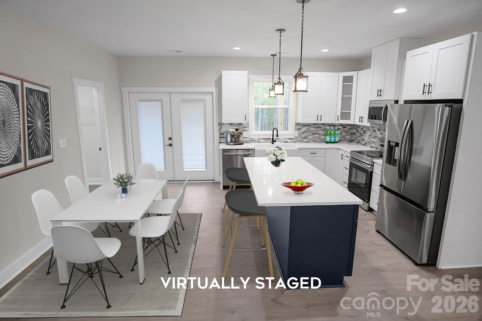 129 Rosecommon Lane Rutherfordton, NC 28139 - Photo 7 of 31 a kitchen with stainless steel appliances granite countertop a refrigerator a stove a sink a dining table and chairs