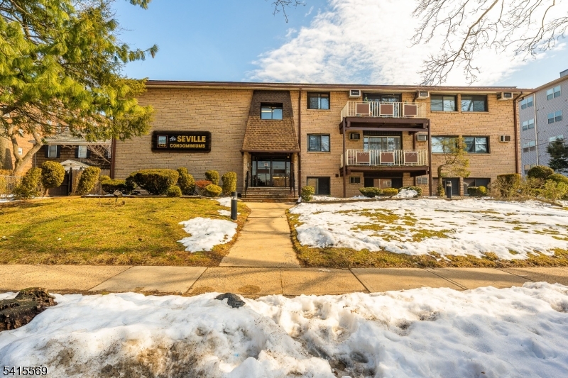 747 North Broad Street Elizabeth, NJ 07208 - Photo 2 of 13 a view of a house with snow on the roadside
