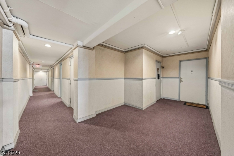 747 North Broad Street Elizabeth, NJ 07208 - Photo 4 of 13 a view of a hallway with white walls
