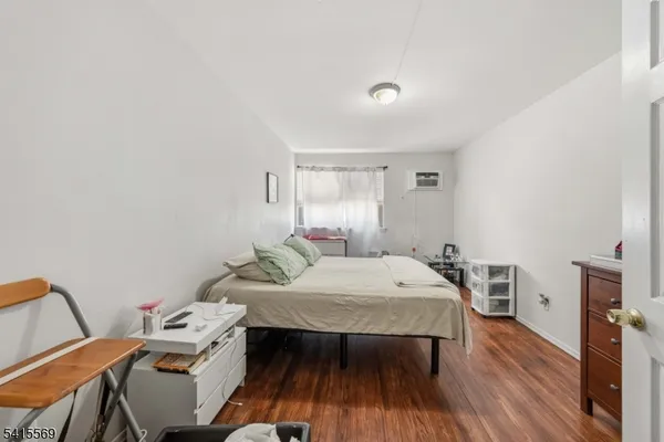 a bedroom with a bed and a table