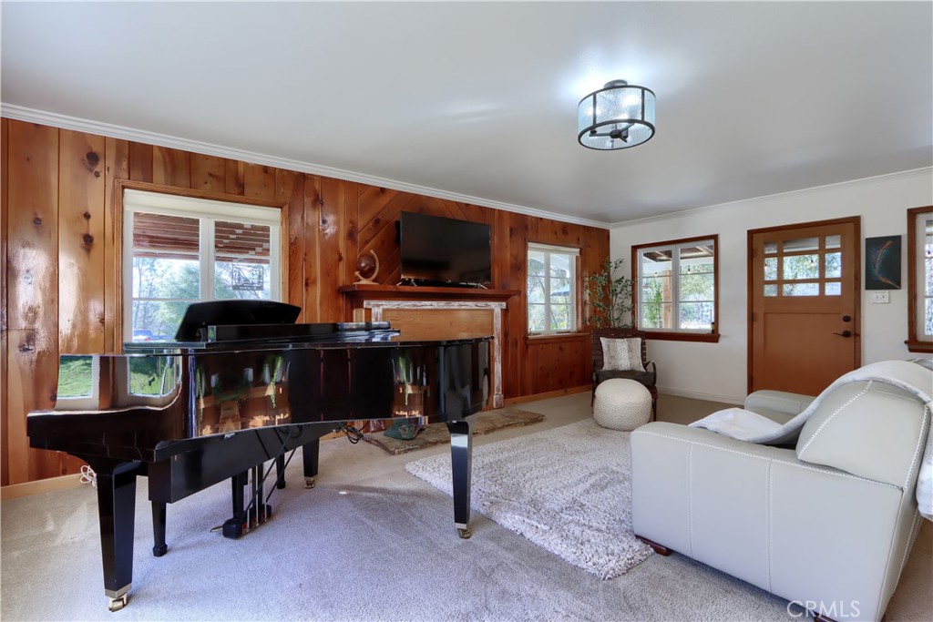 5641 Darrah Road Mariposa, CA 95338 - Photo 15 of 58 a living room with furniture and a fireplace
