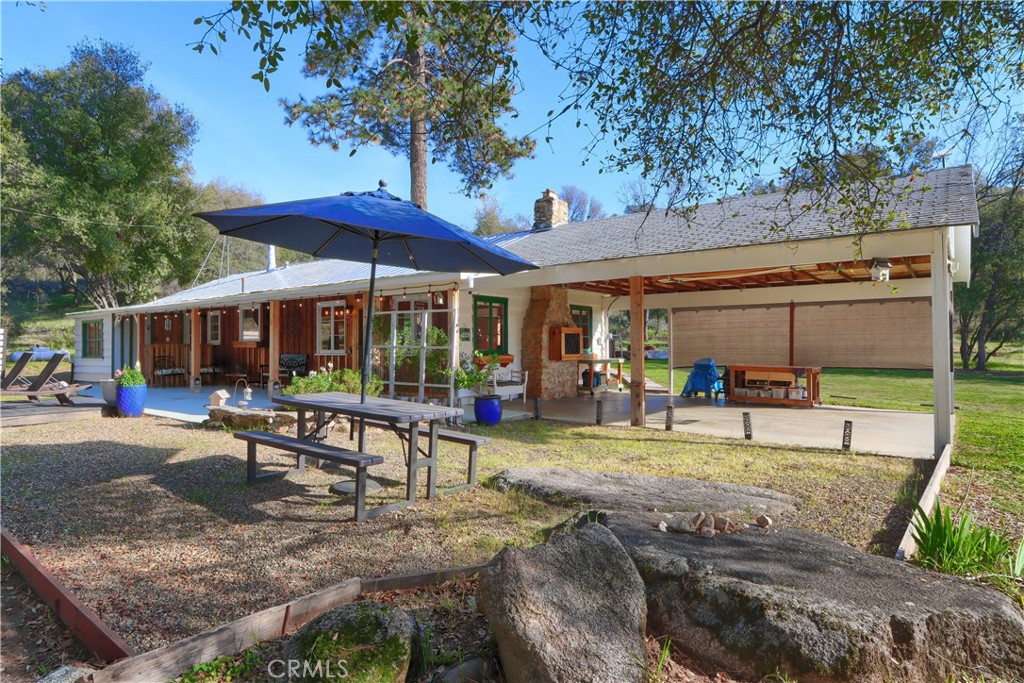 5641 Darrah Road Mariposa, CA 95338 - Photo 2 of 58 a view of a house with backyard porch and sitting area