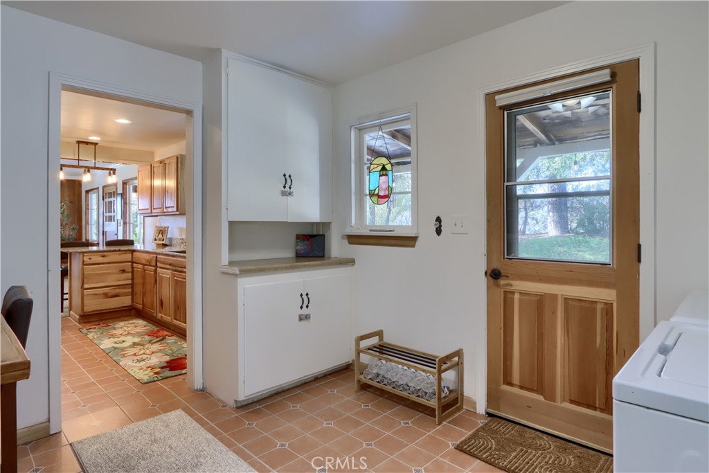 5641 Darrah Road Mariposa, CA 95338 - Photo 21 of 58 a kitchen with a refrigerator and a stove top oven