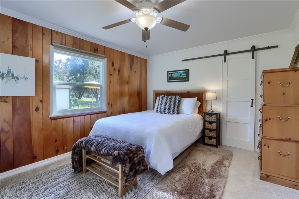 5641 Darrah Road Mariposa, CA 95338 - Photo 27 of 58 a bedroom with a bed and window