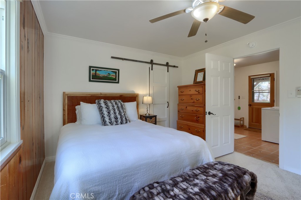 5641 Darrah Road Mariposa, CA 95338 - Photo 28 of 58 a bedroom with a bed and a walk in closet