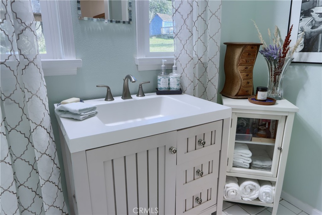 5641 Darrah Road Mariposa, CA 95338 - Photo 30 of 58 a bathroom with a sink a vanity and a mirror