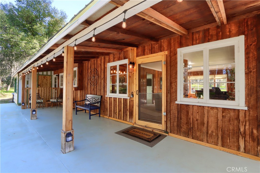 5641 Darrah Road Mariposa, CA 95338 - Photo 33 of 58 a view of outdoor space with porch and wooden floor
