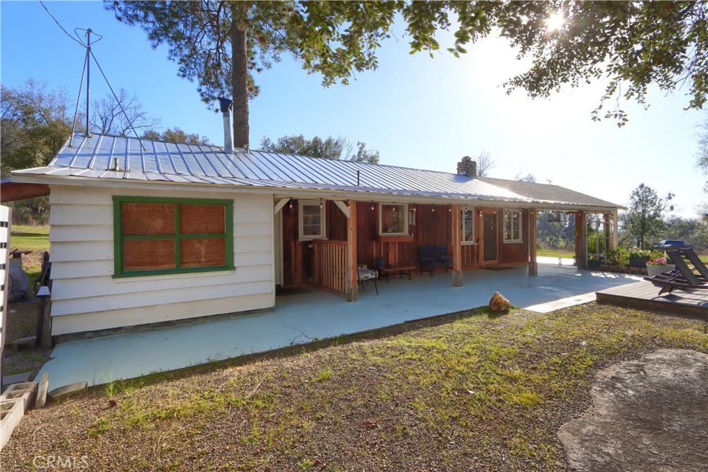 5641 Darrah Road Mariposa, CA 95338 - Photo 34 of 58 a view of a house with a yard and sitting area