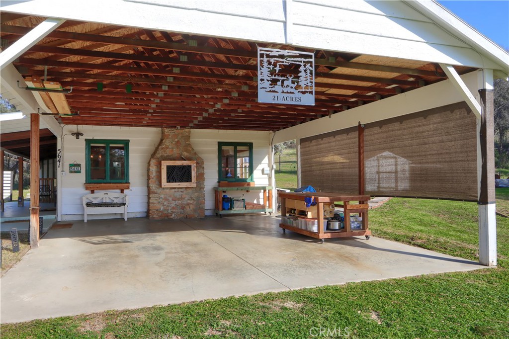 5641 Darrah Road Mariposa, CA 95338 - Photo 35 of 58 a view of a backyard with a patio and fire pit