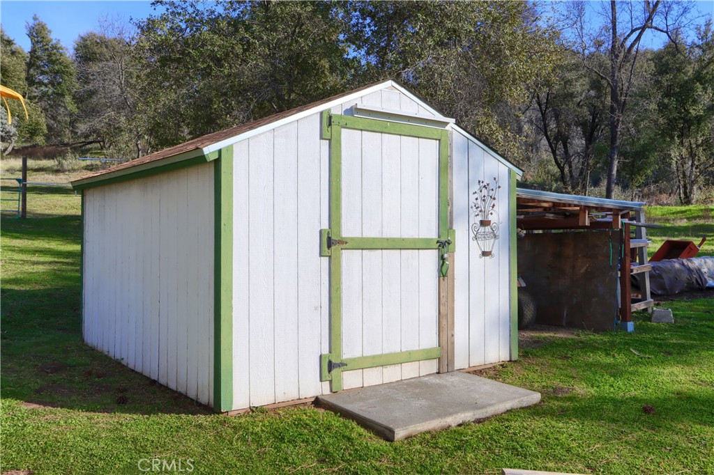 5641 Darrah Road Mariposa, CA 95338 - Photo 45 of 58 a view of backyard with a barn and a cactus plant