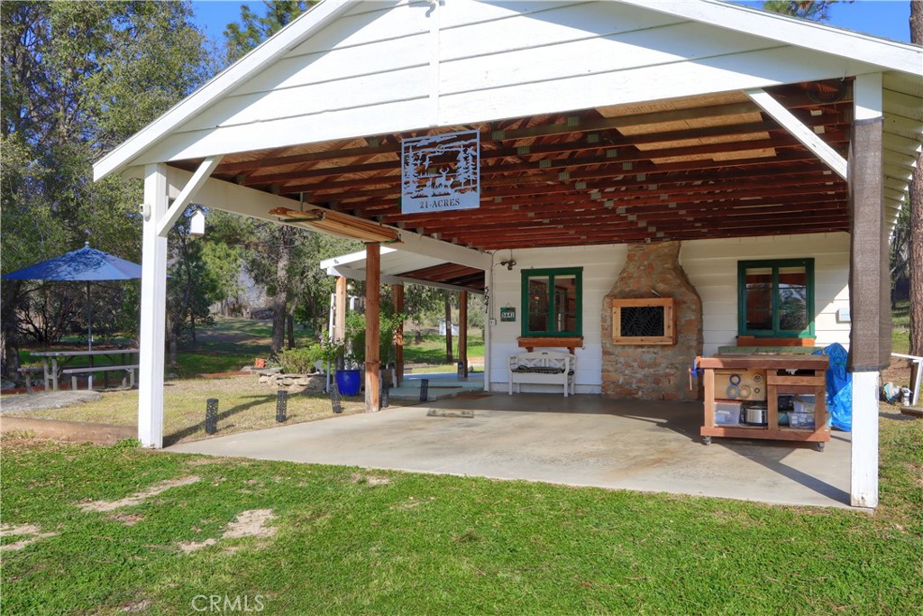 5641 Darrah Road Mariposa, CA 95338 - Photo 9 of 58 a view of a house with backyard porch and sitting area