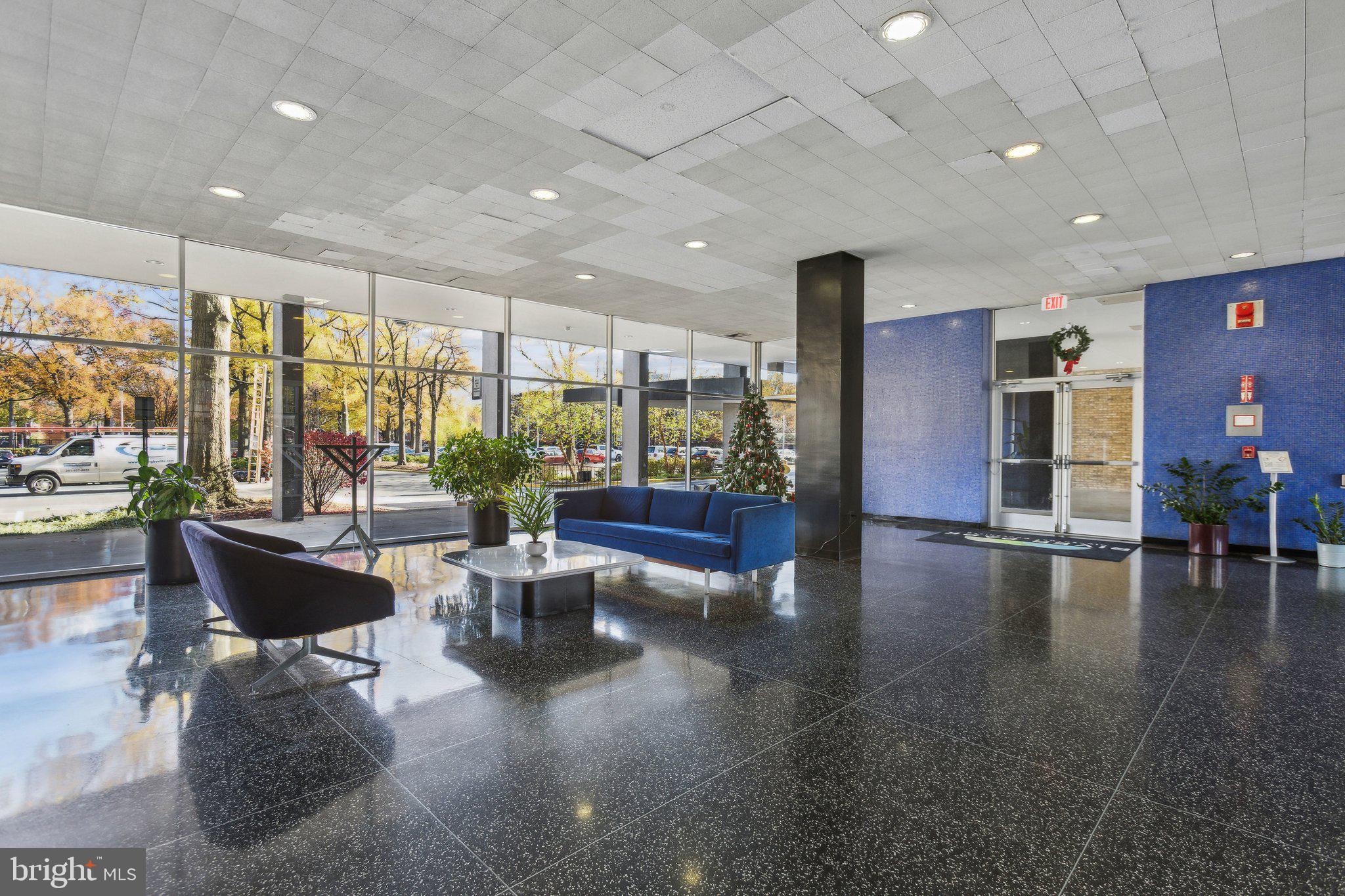 1301 Delaware Avenue Southwest, Unit N523 Washington, DC 20024 - Photo 14 of 25 a living room with fireplace furniture and floor to ceiling window