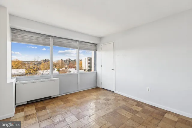 a view of an empty room with a window