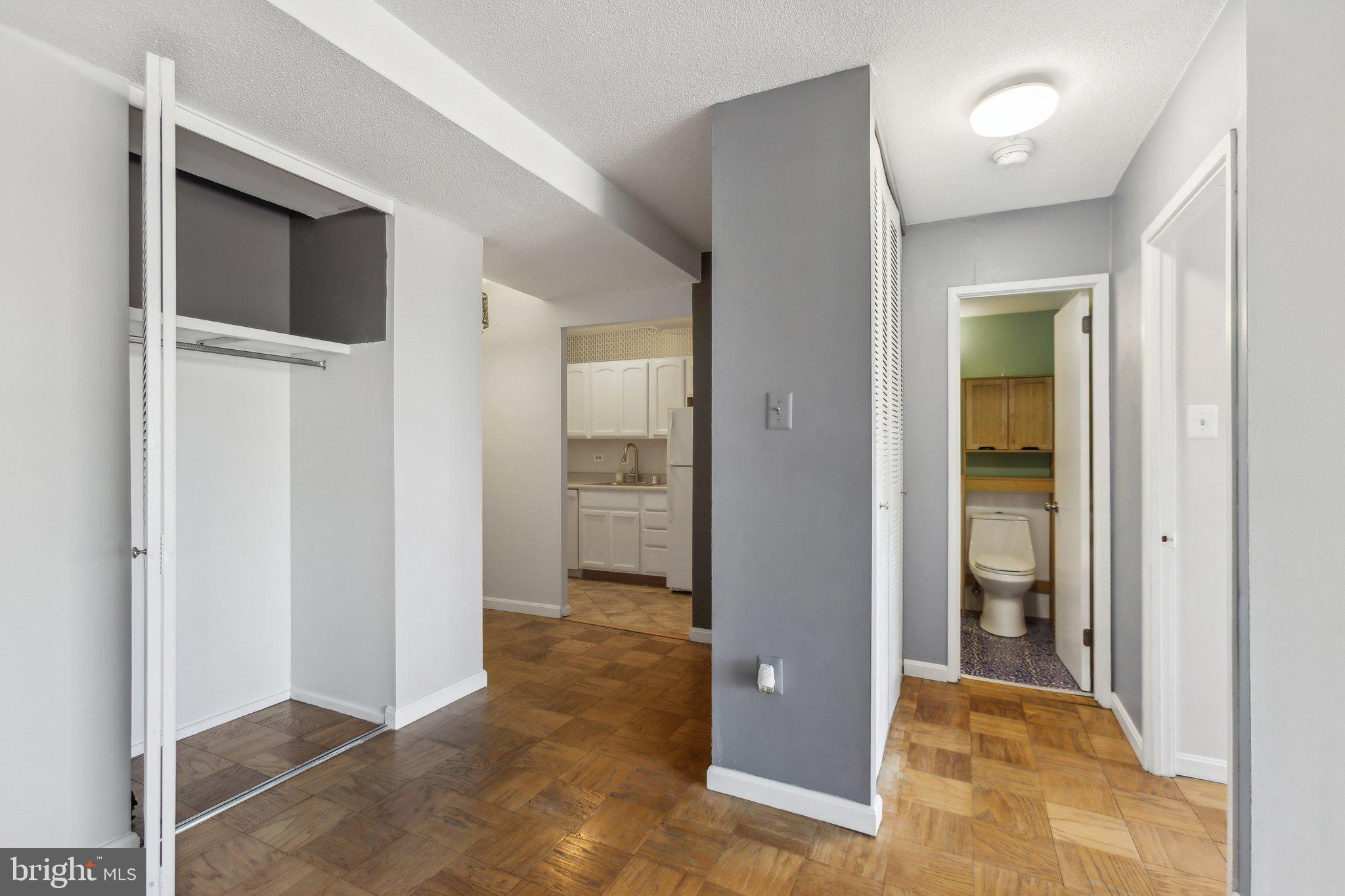 1301 Delaware Avenue Southwest, Unit N523 Washington, DC 20024 - Photo 9 of 25 hallway with wooden floor