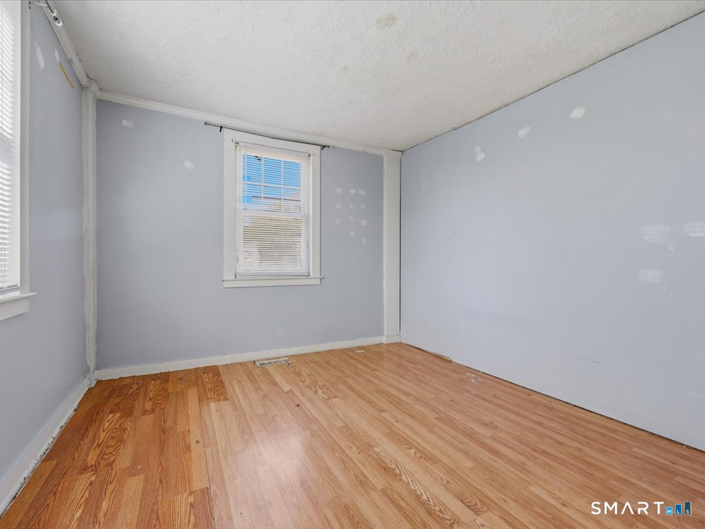 16 Grandview Terrace Portland, CT 06480 - Photo 12 of 37 a view of empty room with wooden floor and fan