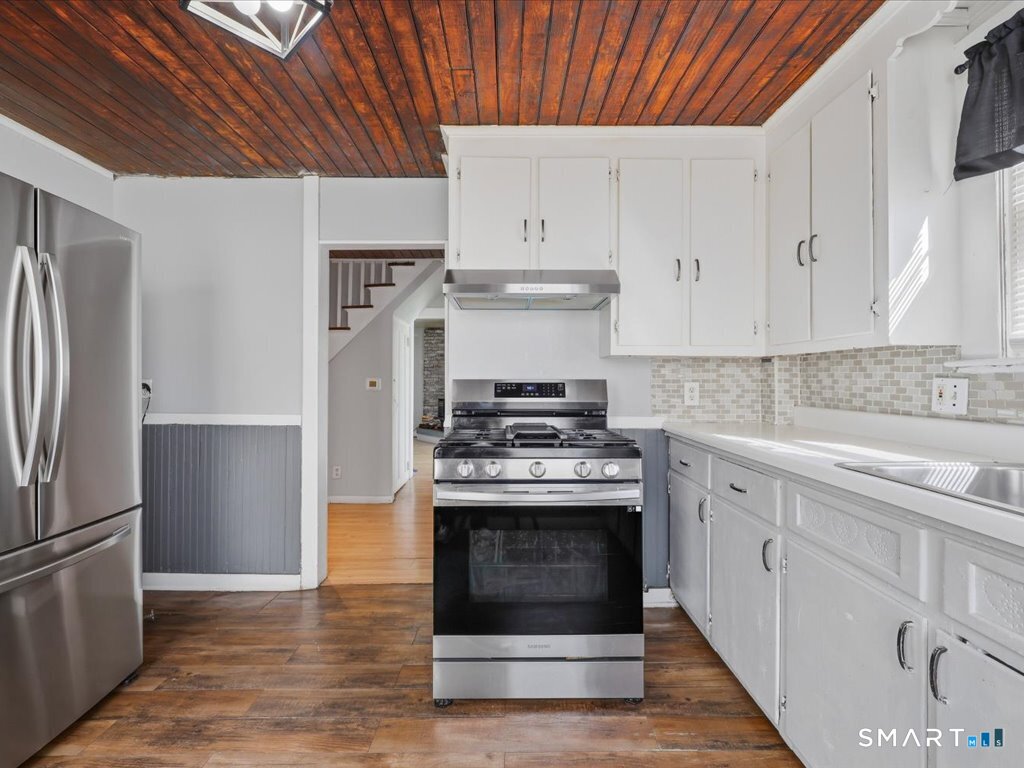 16 Grandview Terrace Portland, CT 06480 - Photo 16 of 37 a kitchen with cabinets and stainless steel appliances