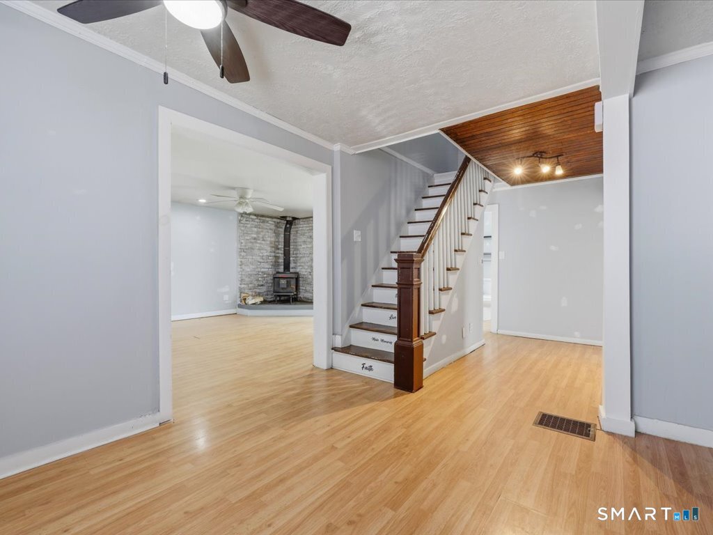 16 Grandview Terrace Portland, CT 06480 - Photo 19 of 37 an empty room with wooden floor and entryway