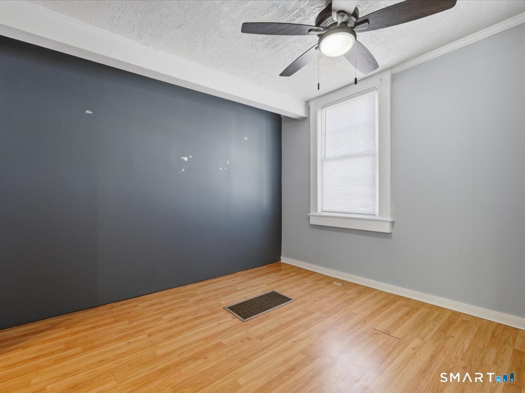 16 Grandview Terrace Portland, CT 06480 - Photo 20 of 37 a view of empty room with wooden floor and fan