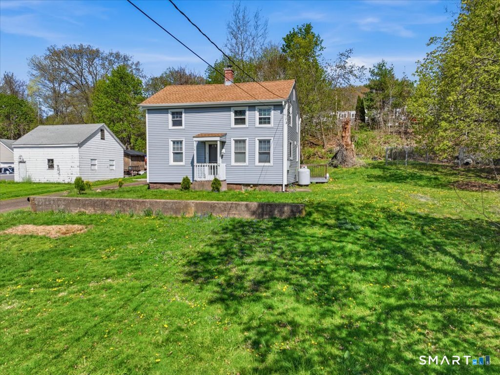16 Grandview Terrace Portland, CT 06480 - Photo 2 of 37 a front view of a house with a yard