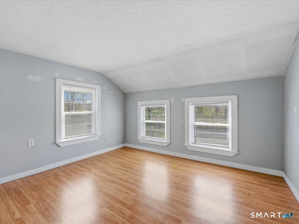 16 Grandview Terrace Portland, CT 06480 - Photo 24 of 37 a view of an empty room with wooden floor and a window