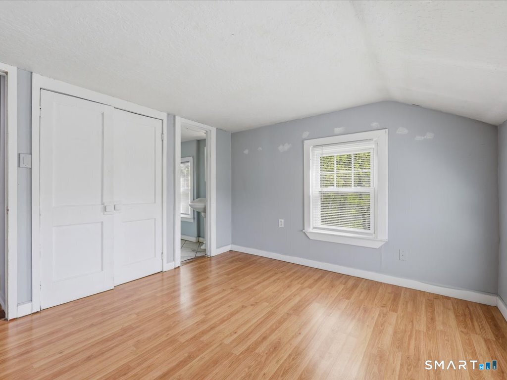 16 Grandview Terrace Portland, CT 06480 - Photo 25 of 37 an empty room with wooden floor and windows