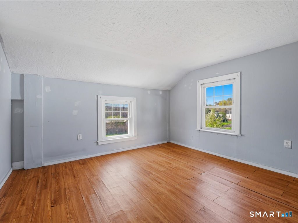 16 Grandview Terrace Portland, CT 06480 - Photo 26 of 37 a view of an empty room with wooden floor and a window