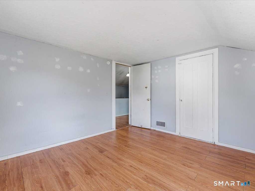 16 Grandview Terrace Portland, CT 06480 - Photo 27 of 37 a view of an empty room with wooden floor
