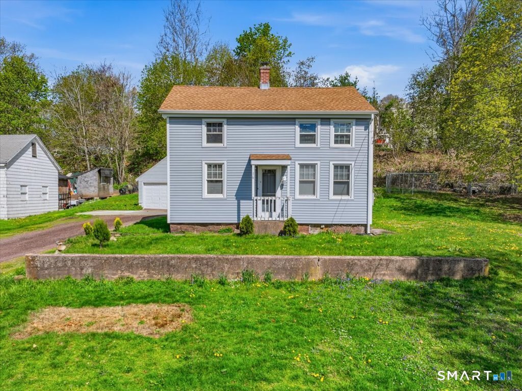 16 Grandview Terrace Portland, CT 06480 - Photo 3 of 37 a front view of a house with a yard