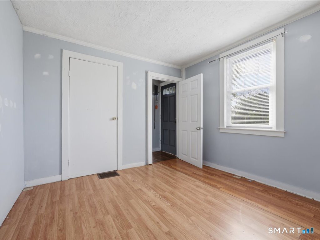 16 Grandview Terrace Portland, CT 06480 - Photo 31 of 37 a view of an empty room with wooden floor and a window