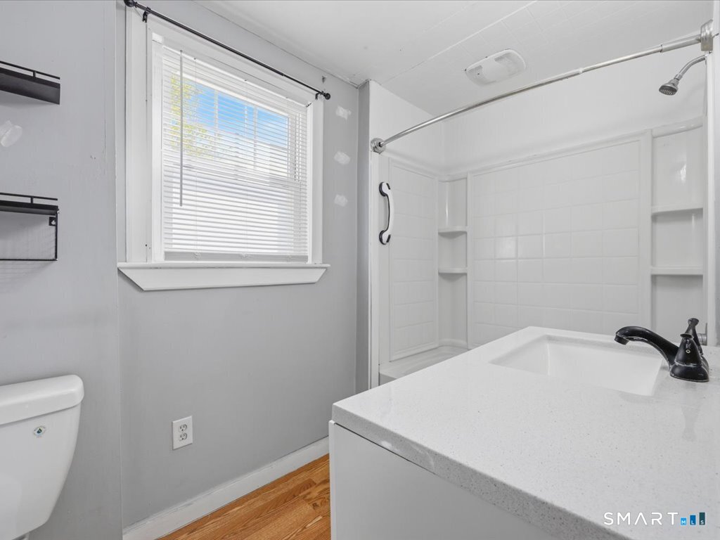 16 Grandview Terrace Portland, CT 06480 - Photo 32 of 37 a bathroom with a sink a toilet and shower