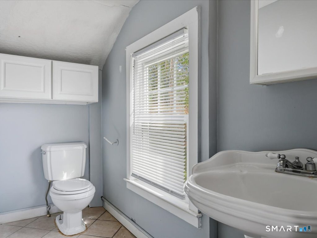 16 Grandview Terrace Portland, CT 06480 - Photo 33 of 37 a bathroom with a toilet a sink and a window