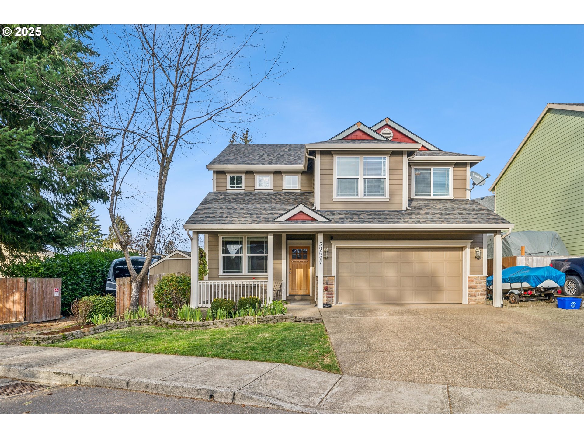 39697 Evans Street Sandy, OR 97055 - Photo 1 of 39 a front view of a house with a yard and garage