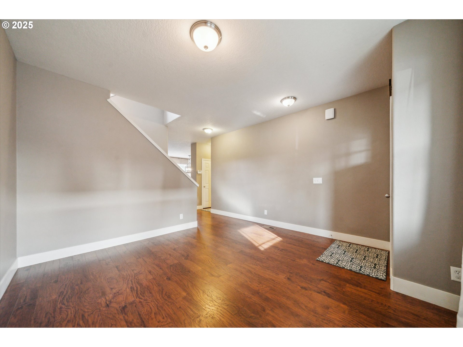 39697 Evans Street Sandy, OR 97055 - Photo 18 of 39 a view of an empty room with wooden floor