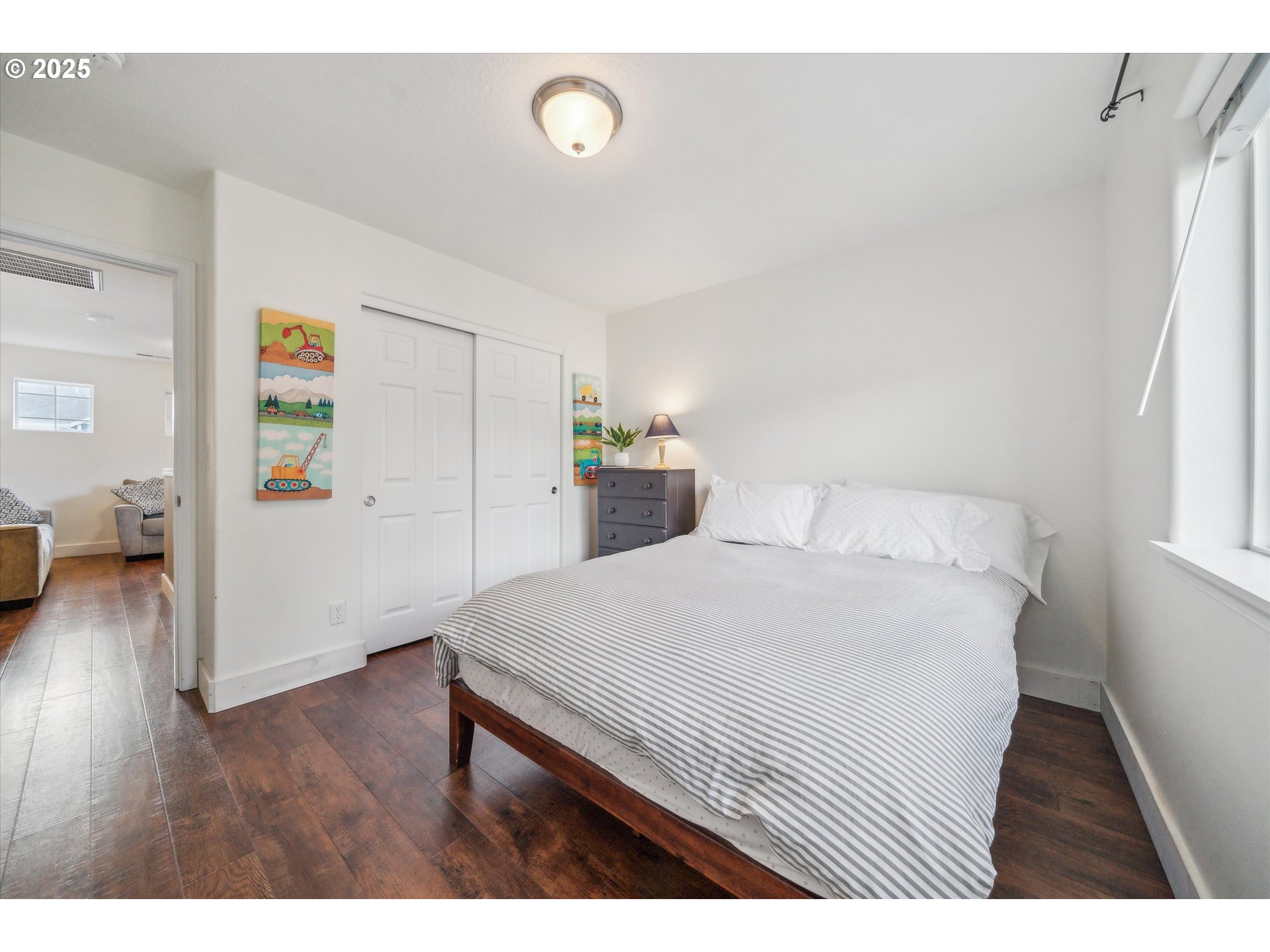 39697 Evans Street Sandy, OR 97055 - Photo 26 of 39 a bedroom with a bed and wooden floor