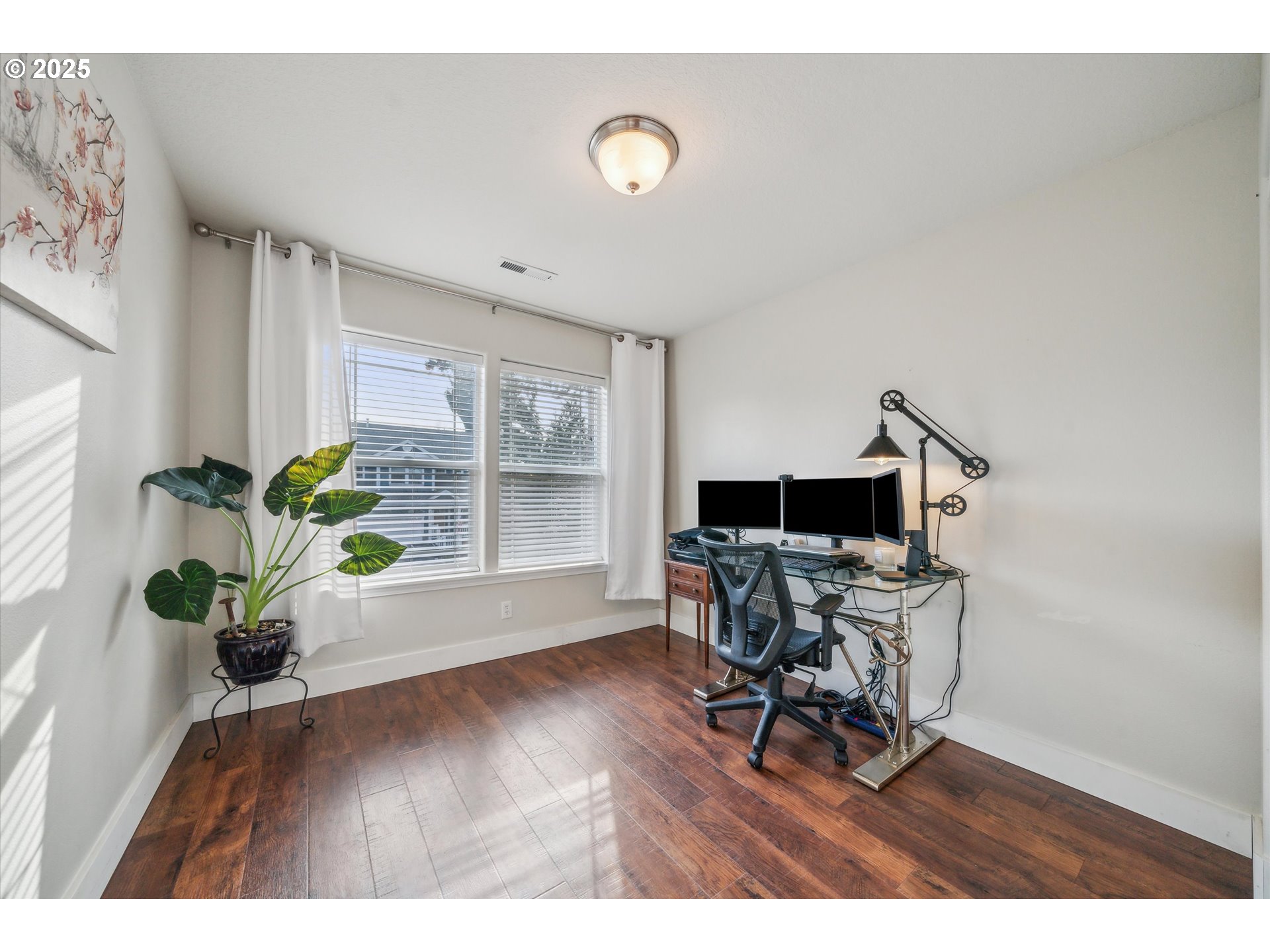 39697 Evans Street Sandy, OR 97055 - Photo 27 of 39 a workspace with furniture and a potted plant