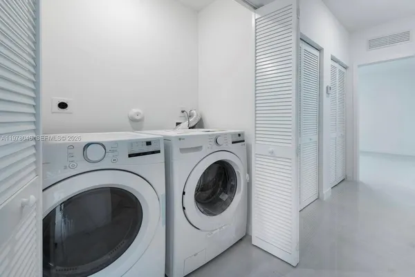 a utility room with dryer and washer
