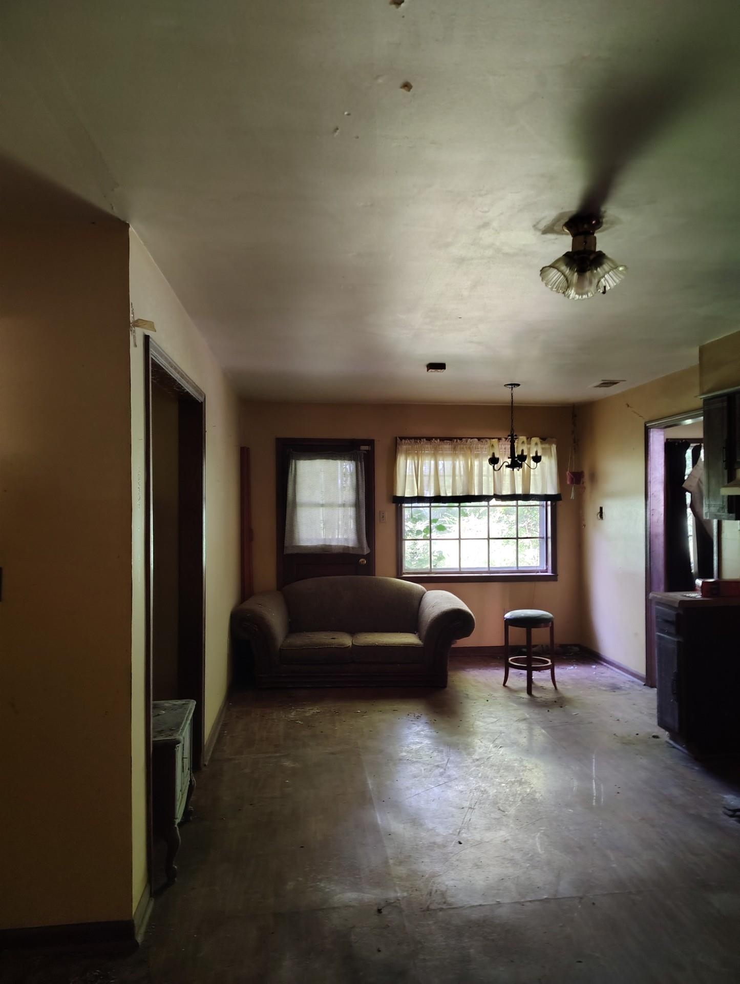 1663 Pisgah Road Cordova, TN 38016 - Photo 2 of 3 a living room with furniture window and a flat screen tv