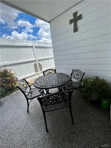 a table and chairs in front of a door