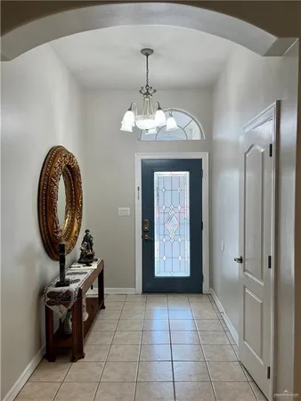 a view of a hallway with entryway wooden floor and front door