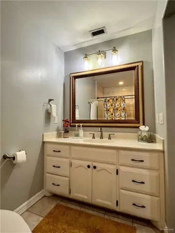 a bathroom with a double vanity sink and mirror